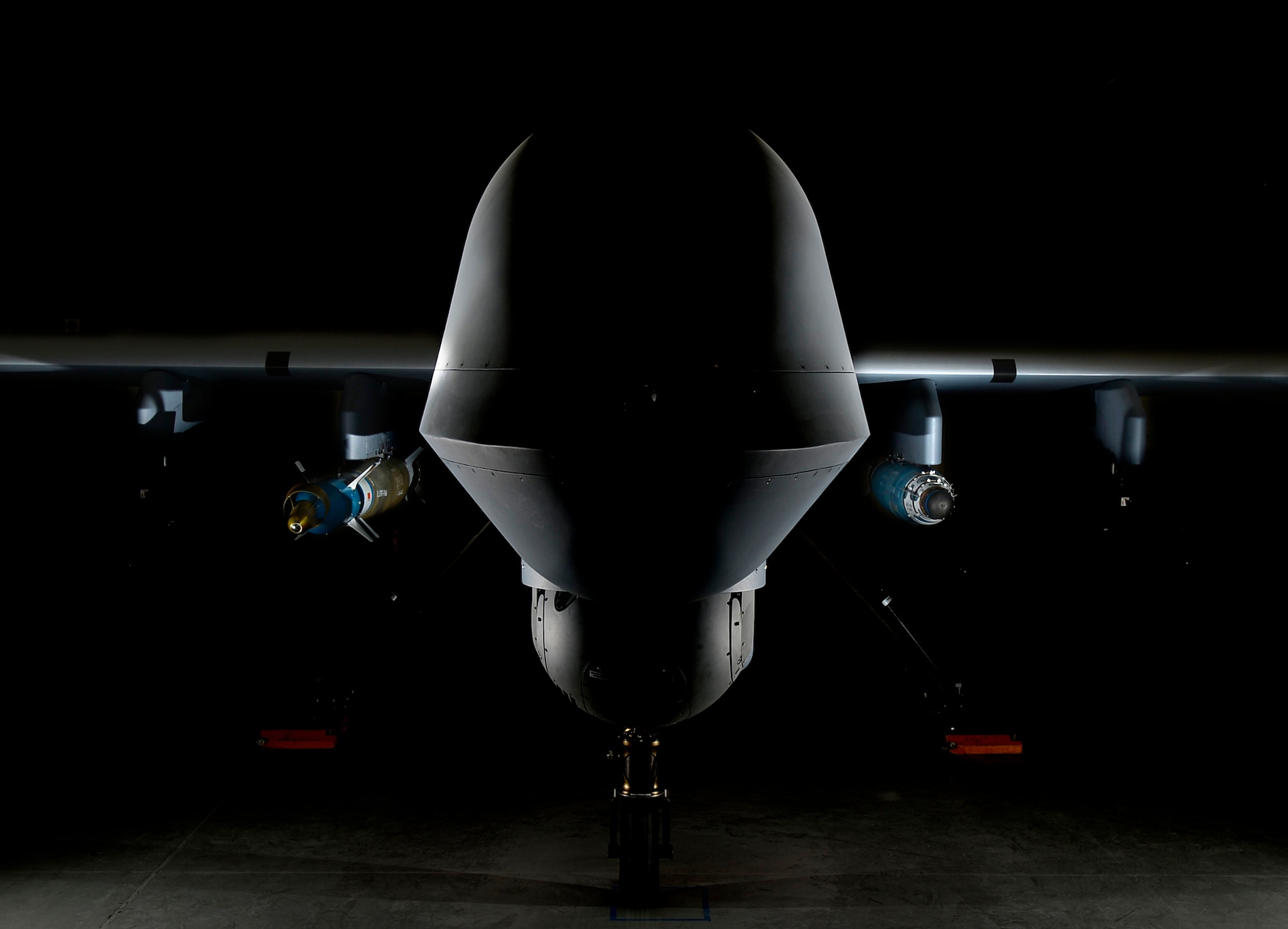 An MQ-9 Reaper is loaded with a GBU-12 laser-guided bomb on the left and a GBU-38 Joint Direct Attack Munition on the right April 13, 2017, at Creech Air Force Base, Nev. The JDAM is a GPS guided munition which brings added capability to the warfighters, specifically by aircrews being able to employ weapons through inclement weather. The first two GBU-38s employed in training successfully hit their targets May 1, 2017, over the Nevada Test and Training Range. (U.S. Air Force photo by Senior Airman Christian Clausen)