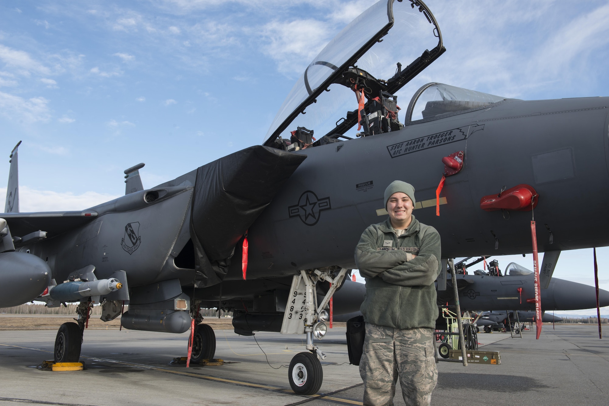EIELSON AIR FORCE BASE, Alaska – U.S. Air Force Airman 1st Class Ryan Landrum, a 335th Aircraft Maintenance Unit weapons load crew member assigned to Seymour Johnson Air Force Base, N.C., poses for a photo in front of an F-15E Strike Eagle dual-role fighter aircraft from the 335th Fighter Squadron, May 4, 2017 during NORTHERN EDGE 2017 (NE17), at Eielson Air Force Base, Alaska. NE17 is Alaska’s premier joint training exercise designed to practice operations, techniques and procedures as well as enhance interoperability among the services. Thousands of participants from all the services, Airmen, Soldiers, Sailors, Marines and Coast Guardsmen from active duty, Reserve and National Guard units are involved. (U.S. Air Force photo/Staff Sgt. Ashley Nicole Taylor)