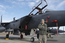 EIELSON AIR FORCE BASE, Alaska – U.S. Air Force Airman 1st Class Ryan Landrum, a 335th Aircraft Maintenance Unit weapons load crew member assigned to Seymour Johnson Air Force Base, N.C., poses for a photo in front of an F-15E Strike Eagle dual-role fighter aircraft from the 335th Fighter Squadron, May 4, 2017 during NORTHERN EDGE 2017 (NE17), at Eielson Air Force Base, Alaska. NE17 is Alaska’s premier joint training exercise designed to practice operations, techniques and procedures as well as enhance interoperability among the services. Thousands of participants from all the services, Airmen, Soldiers, Sailors, Marines and Coast Guardsmen from active duty, Reserve and National Guard units are involved. (U.S. Air Force photo/Staff Sgt. Ashley Nicole Taylor)