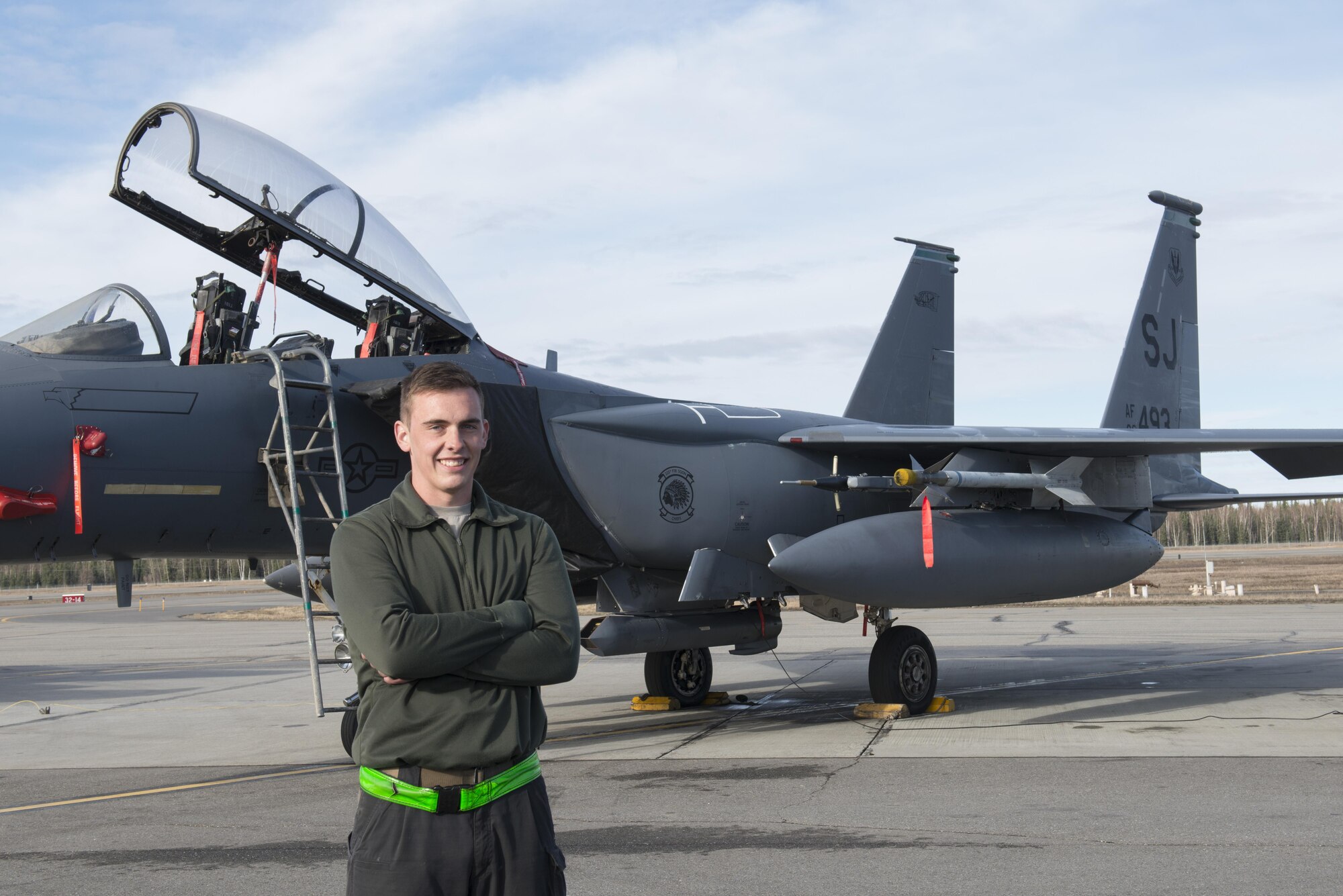 EIELSON AIR FORCE BASE, Alaska – U.S. Air Force Staff Sgt. Ryan Merritt, a 335th Aircraft Maintenance Unit crew chief assigned to Seymour Johnson Air Force Base, N.C., poses for a photo in front of an F-15E Strike Eagle dual-role fighter aircraft from the 335th Fighter Squadron, May 4, 2017, during NORTHERN EDGE 2017 (NE17), at Eielson Air Force Base, Alaska. NE17 is Alaska’s premier joint training exercise designed to practice operations, techniques and procedures as well as enhance interoperability among the services. Thousands of participants from all the services, Airmen, Soldiers, Sailors, Marines and Coast Guardsmen from active duty, Reserve and National Guard units are involved. (U.S. Air Force photo/Staff Sgt. Ashley Nicole Taylor)