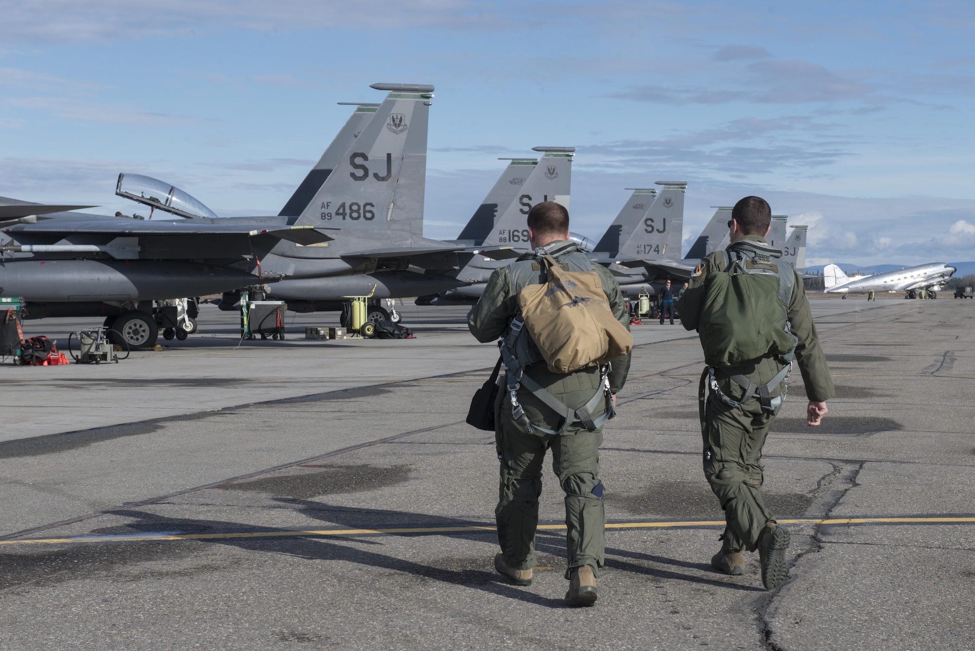 EIELSON AIR FORCE BASE, Alaska – U.S. Air Force F-15E Strike Eagle dual-role fighter aircraft pilots assigned to the 335th Fighter Squadron, Seymour Johnson Air Force Base, N.C., step to their jet and prepare for pre-flight inspections, May 4, 2017, during NORTHERN EDGE 2017 (NE17), at Eielson Air Force Base, Alaska. NE17 is Alaska’s premier joint training exercise designed to practice operations, techniques and procedures as well as enhance interoperability among the services. Thousands of participants from all the services, Airmen, Soldiers, Sailors, Marines and Coast Guardsmen from active duty, Reserve and National Guard units are involved. (U.S. Air Force photo/Staff Sgt. Ashley Nicole Taylor)