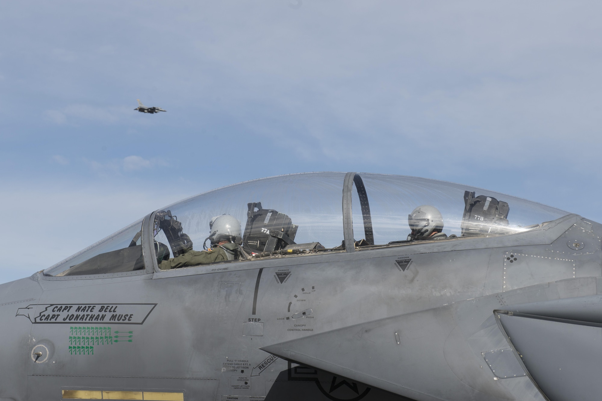 EIELSON AIR FORCE BASE, Alaska – U.S. Air Force F15E Strike Eagle dual-role fighter aircraft pilots assigned to the 335th Fighter Squadron, Seymour Johnson Air Force Base, N.C., watch as an F-16 Fighting Falcon aircraft assigned to the 13th Fighter Squadron, Misawa Air Base, Japan, takes off for a sortie during NORTHERN EDGE 2017 (NE17), May 4, 2017, at Eielson Air Force Base, Alaska. NE17 is Alaska’s premier joint training exercise designed to practice operations, techniques and procedures as well as enhance interoperability among the services. Thousands of participants from all the services, Airmen, Soldiers, Sailors, Marines and Coast Guardsmen from active duty, Reserve and National Guard units are involved. (U.S. Air Force photo/Staff Sgt. Ashley Nicole Taylor)