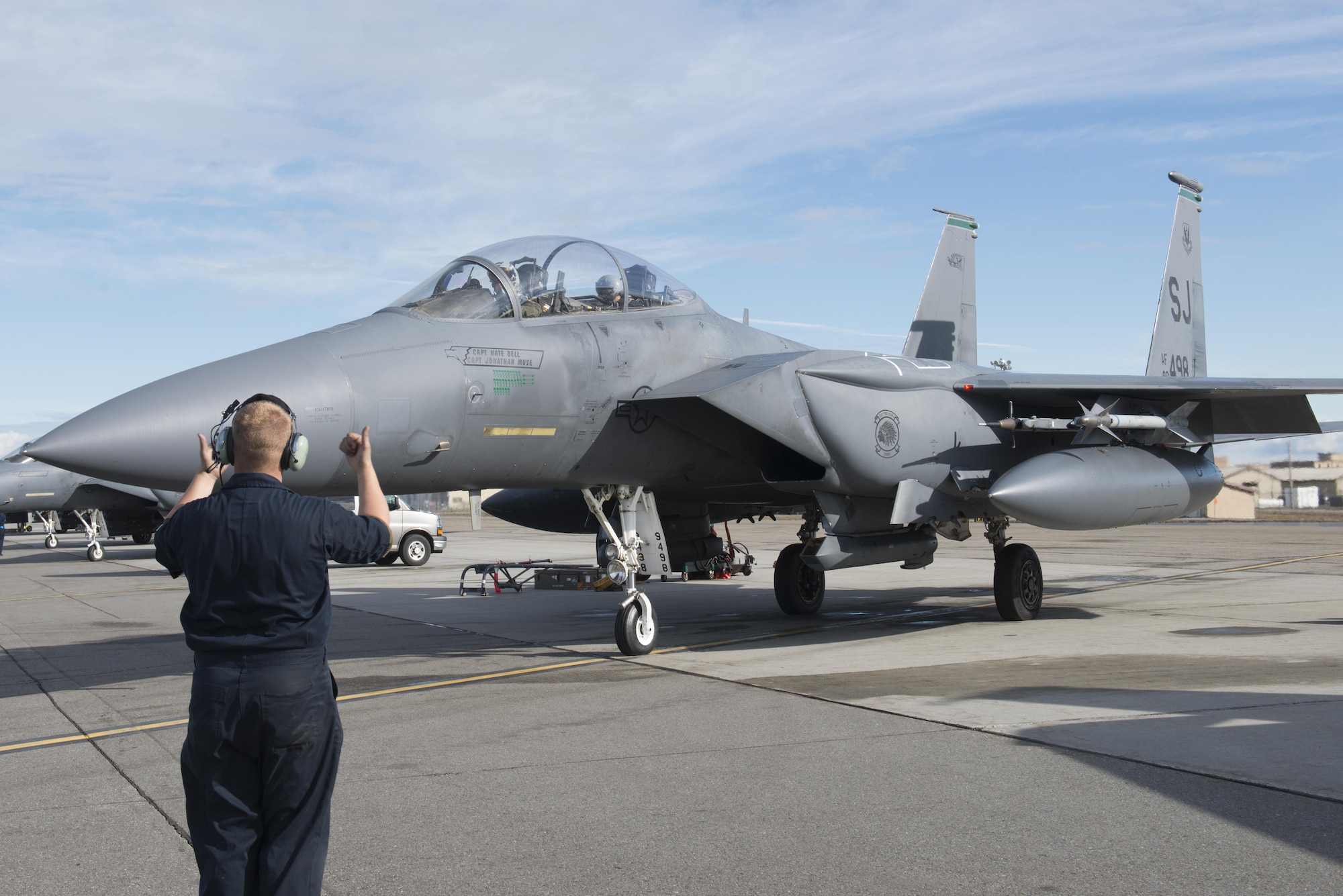 EIELSON AIR FORCE BASE, Alaska – U.S. Air Force Staff Sgt. Brandon Coffman, a 335th Aircraft Maintenance Unit crew chief assigned to Seymour Johnson Air Force Base, N.C., signals to F-15E Strike Eagle dual-role fighter aircraft pilots from the 335th Fighter Squadron, May 4, 2017, during NORTHERN EDGE 2017 (NE17), at Eielson Air Force Base, Alaska. NE17 is Alaska’s premier joint training exercise designed to practice operations, techniques and procedures as well as enhance interoperability among the services. Thousands of participants from all the services, Airmen, Soldiers, Sailors, Marines and Coast Guardsmen from active duty, Reserve and National Guard units are involved. (U.S. Air Force photo/Staff Sgt. Ashley Nicole Taylor)