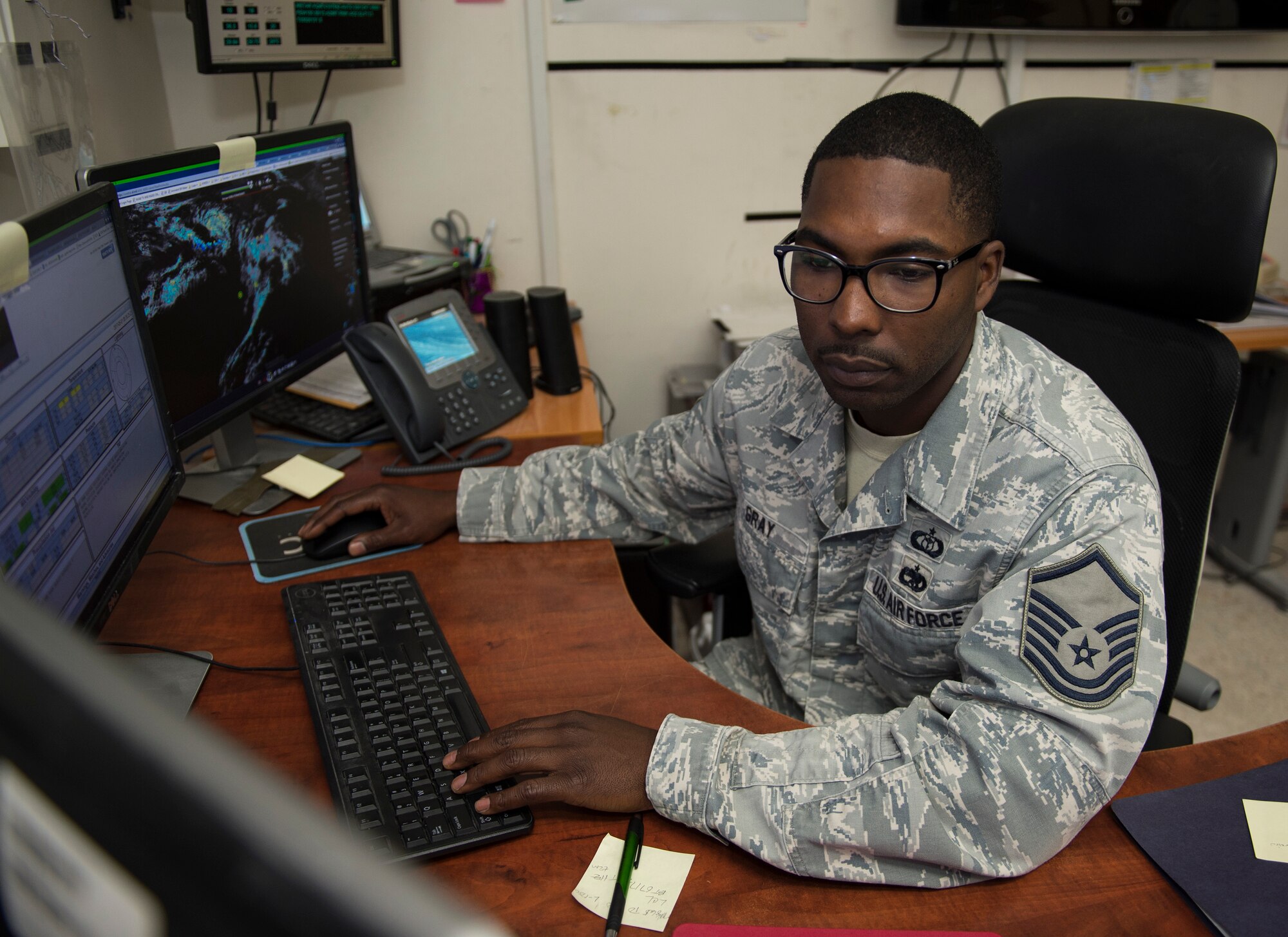 U.S. Air Force Master Sgt. Deerick Gray, flight chief with the 379th Expeditionary Operations Support Squadron, Operations Weather Flight, performs a meteorological watch for the U.S. Central Command area of responsibility at Al Udeid Air Base, Qatar, May 1, 2017. Gray is utilizing the latest information to predict weather patterns, prepare forecasts and communicate weather information to commanders and pilots so their mission goes as planned. (U.S. Air Force photo by Tech. Sgt. Amy M. Lovgren)