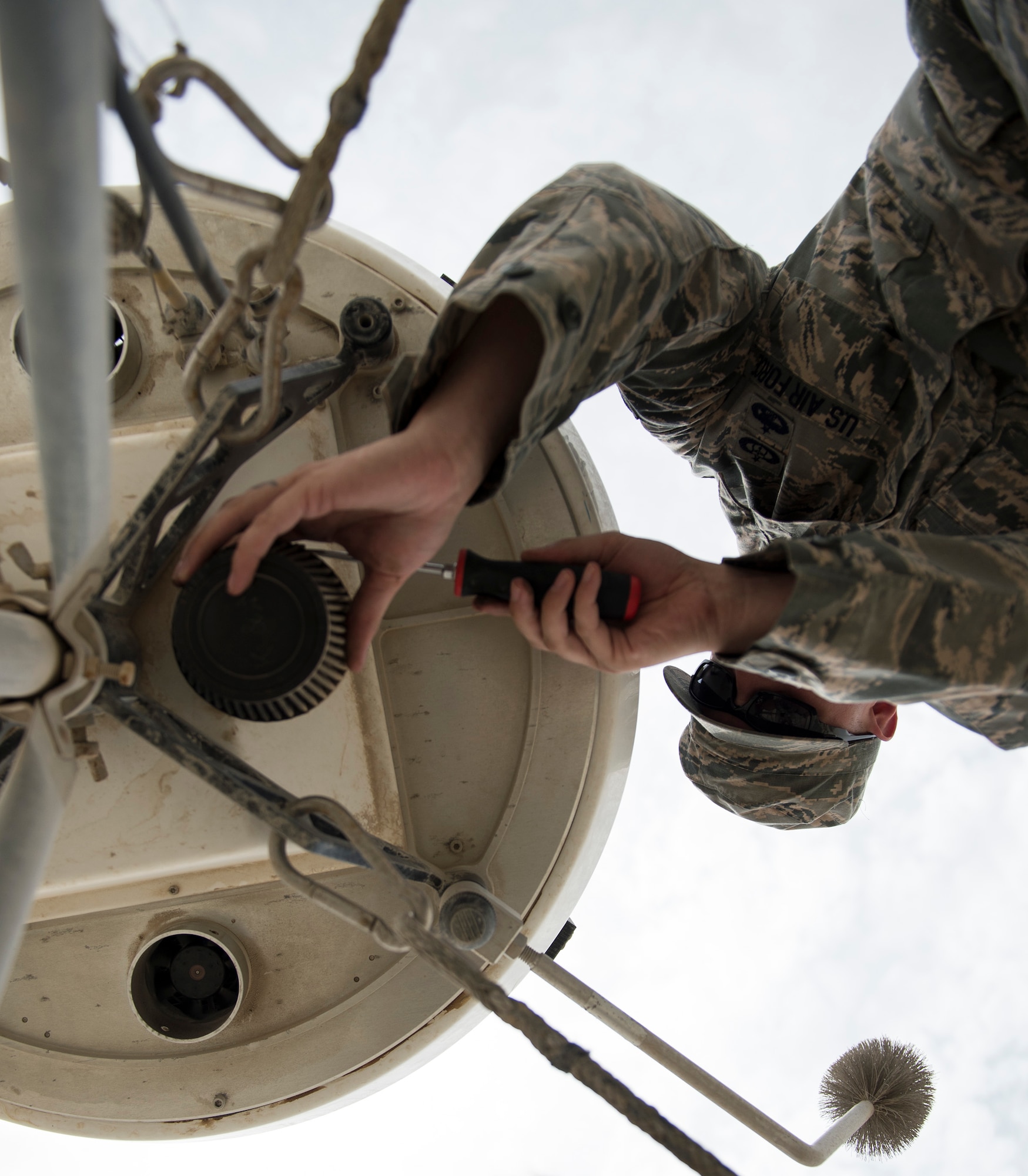 U.S. Air Force Staff Sgt. Erik Gaunt, mission services NCOIC with the 379th Expeditionary Operations Support Squadron, Operations Weather Flight changes the air filter on a portal doppler radar at Al Udeid Air Base, Qatar, May 1, 2017. Gaunt is performing preventive maintenance on the radar so it can provide accurate and timely weather information to commanders and pilots so their mission goes as planned. (U.S. Air Force photo by Tech. Sgt. Amy M. Lovgren)
