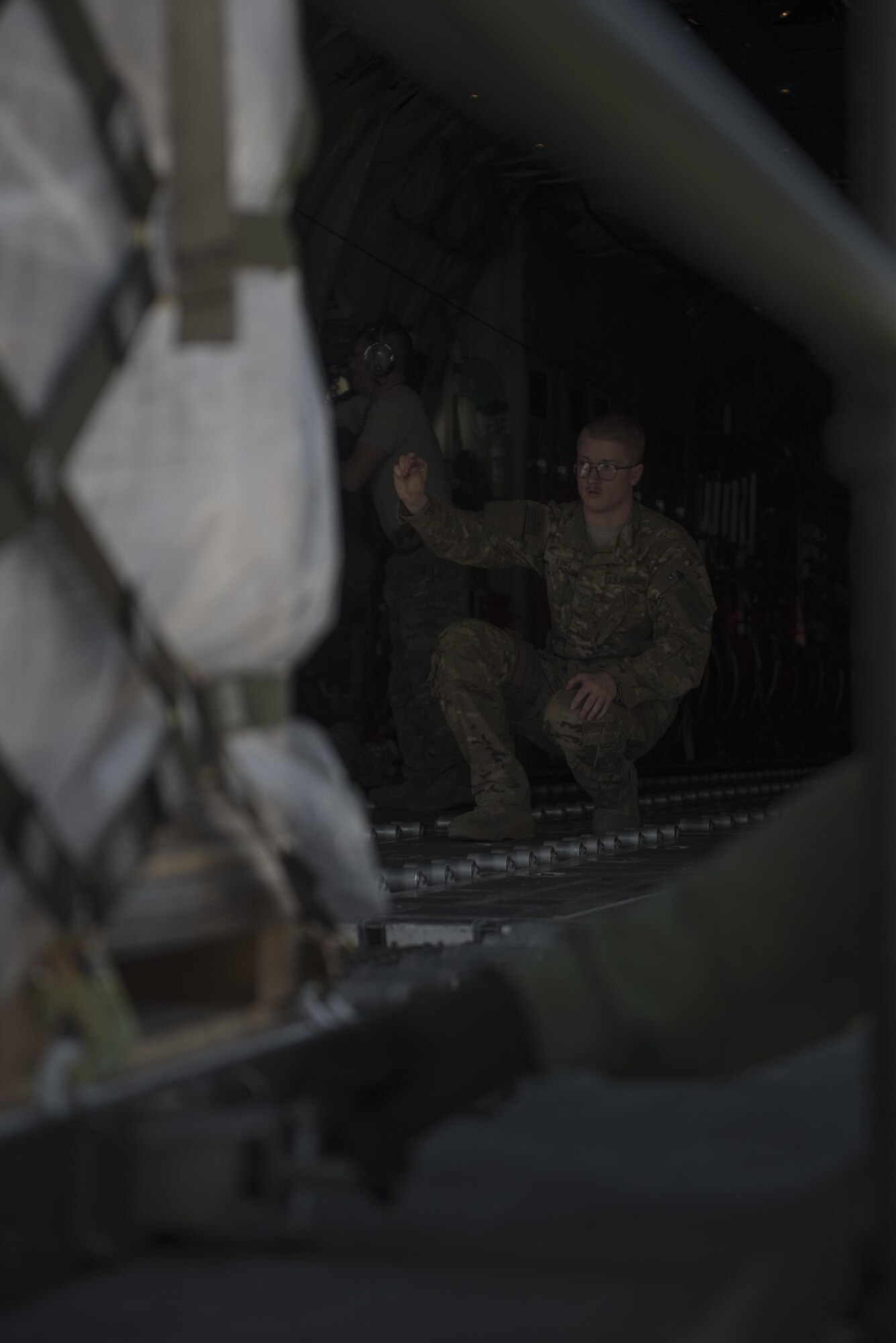 Senior Airman Brandon King, a 774th Expeditionary Airlift Squadron loadmaster, directs the placement of cargo on a C-130J Super Hercules at Bagram Airfield, Afghanistan, May 5, 2017. The 774th EAS provides tactical airlift capabilities in the Afghan theater, which often involves non-standard or outsized cargo and personnel movement. (U.S. Air Force photo by Staff Sgt. Benjamin Gonsier)