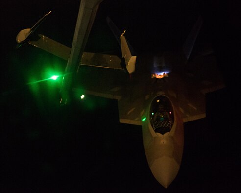 Lt. Col. Shell, 27th Fighter Squadron commander, pilots an F-22A Raptor toward a KC-10 Extender boom May 2, 2017, over an undisclosed location in southwest Asia. The 27 EFS reaches its 100th anniversary May 8, 2017. (U.S. Air Force photo by Senior Airman Preston Webb)