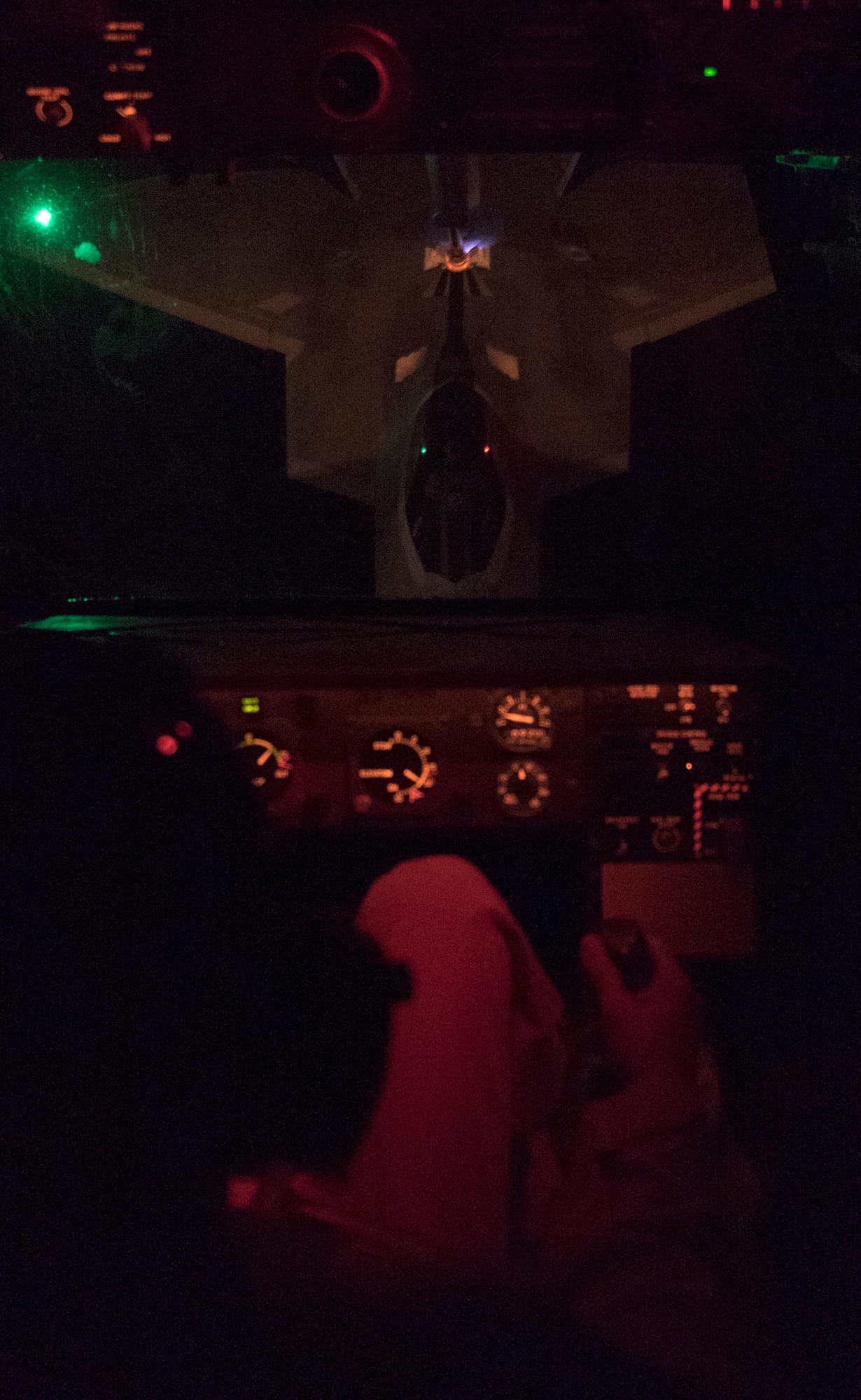 Master Sgt. Michael, 908th Expeditionary Air Refueling Squadron boom operator, refuels an F-22A Raptor piloted by Lt. Col. Shell, 27th Expeditionary Fighter Squadron commander, May 2, 2017, over an undisclosed location in southwest Asia. The 27 EFS enables the Air Force Global Strike by providing combat air support against ISIS. (U.S. Air Force photo by Senior Airman Preston Webb)