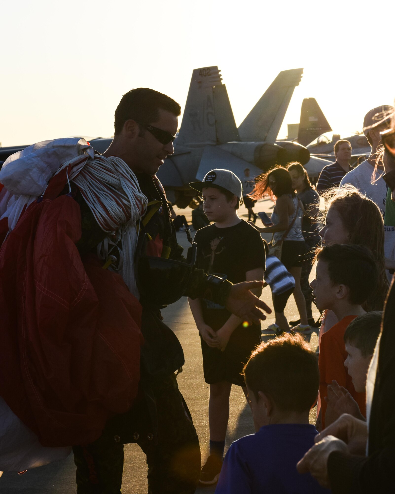 A member of the Canadian Skyhawks parachute team meets and greets spectators during the 2017 Defenders of Liberty Air Show at Barksdale Air Force Base, La., May 5, 2017. The SkyHawks are Canada’s only military parachute demonstration team. For over 40 years, they have represented Canada and the Canadian Armed Forces to over 75 million spectators worldwide under their signature Canadian flag parachutes. (U.S. Air Force photo/Senior Airman Luke Hill)