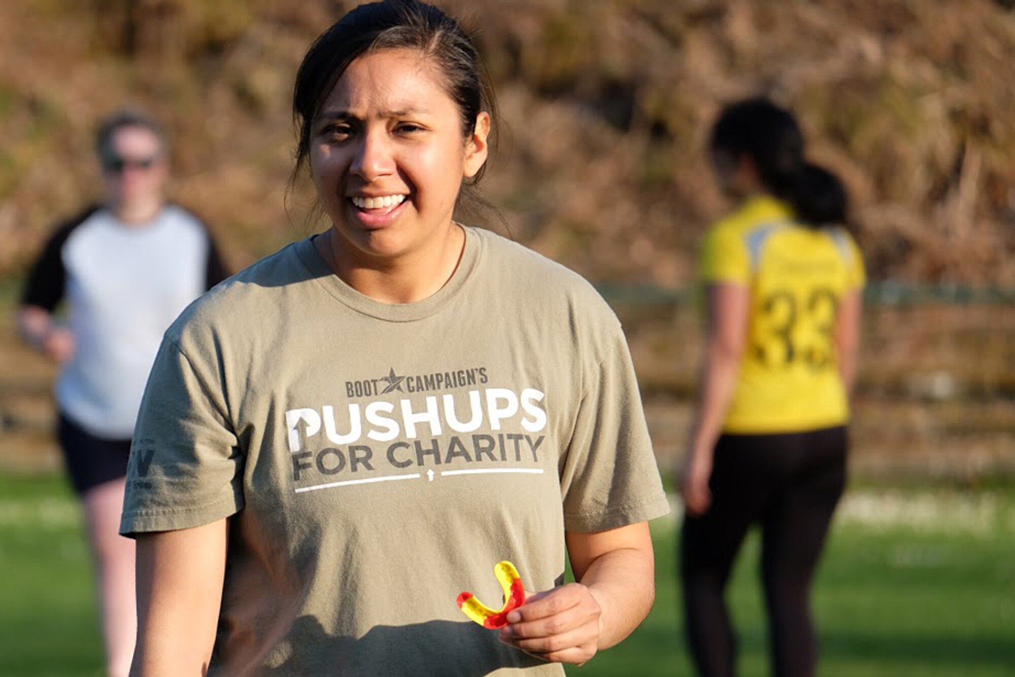 A Kaiserslautern women’s rugby team member takes a break after practicing in Hochspeyer, Germany, April 18, 2017. The team warmed up before their practice by performing a series of drills up and down the field. (U.S. Air Force photo/A1C Alexis C. Schultz)
