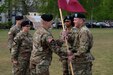 Left, Army Reserve Col. Daniel F. Bohmer, commander, Medical Support Unit – Europe, 7th Mission Support Command receives the MSU-E unit colors from Army Reserve Brig. Gen. Steven W. Ainsworth, the 7th MSC commanding general, right, as Army Reserve Col. Bidemi Y. Olaniyi-Leyimu, former commander, MSU-E, 7th MSC, center, looks on, during an outdoor change of command ceremony on Daenner Kaserne, May 6, 2017. 
The MSU-E is an Army Reserve unit under the command of the 7th MSC, which has Soldiers with 29 medical specialties plus administrative professionals.
