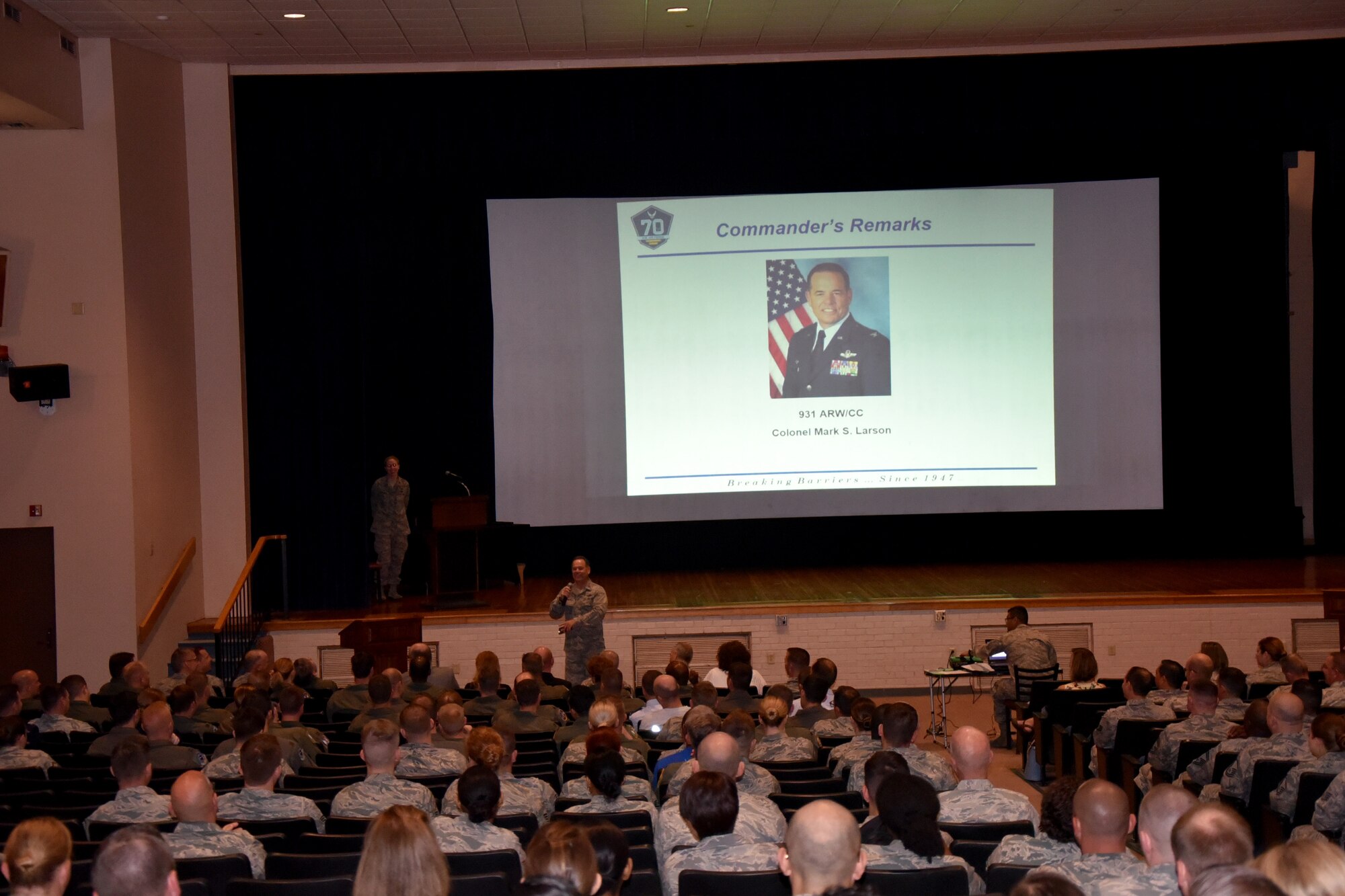 Col. Mark S. Larson, 931st Air Refueling Wing commander, speaks to Airmen gathered for a Commander's Call during the May Unit Training Assembly May 7, 2017, McConnell Air Force Base, Kan. During the event, Col. Mark S. Larson, 931 ARW commander, took time to recognize quarterly award winners. The Commander's Call also included an Honorary Commander Change of Command Ceremony for Mayor Jeff Longwell, the incoming HCC, and the outgoing James Havers-Strong. (U.S. Air Force photo by Tech. Sgt. Abigail Klein)