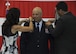 The 442d Fighter Wing Commander Brig. Gen. Brian Borgen's wife and son pin on his new rank during his promotion ceremony at Whiteman Air Force Base, Mo., May 6, 2017. Borgen commands approximately 1,300 Air Force reservists and 24 A-10 Thunderbolt II aircraft at Whiteman AFB and the 476th Fighter Group, a geographically separated unit located at Moody AFB, Ga. (U.S. Air Force photo by Senior Airman Missy Sterling)