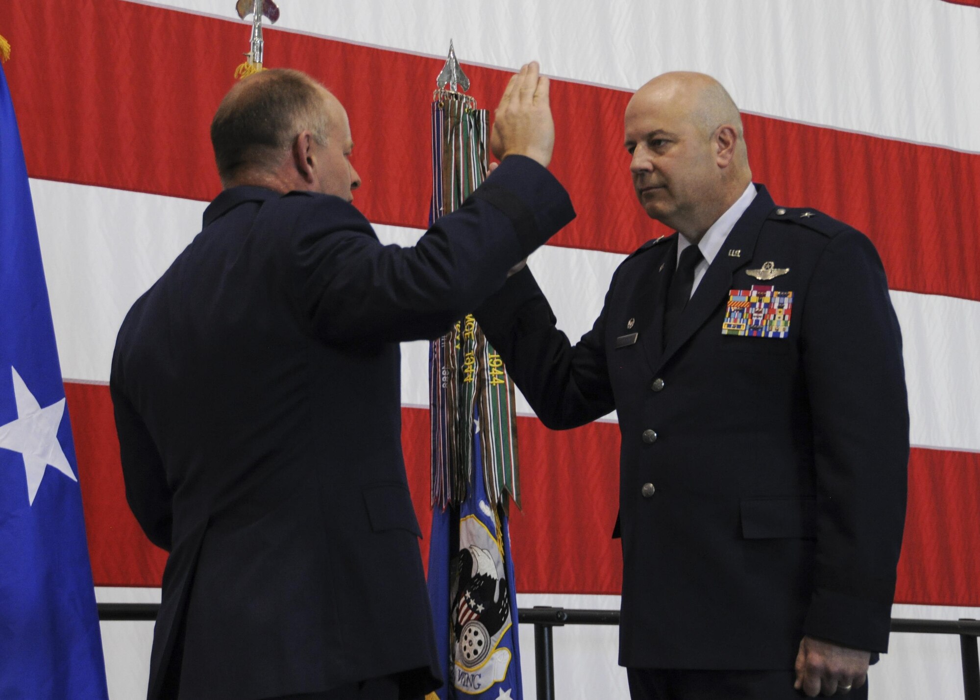 Brig. Gen. Brian Borgen, the commander of the 442d Fighter Wing, takes the oath of office during his promotion ceremony at Whiteman Air Force Base, Mo., May 6, 2017. Borgen has earned numerous medals and awards for his achievements, including the Legion of Merit and the Bronze Star. (U.S. Air Force photo by Senior Airman Missy Sterling)