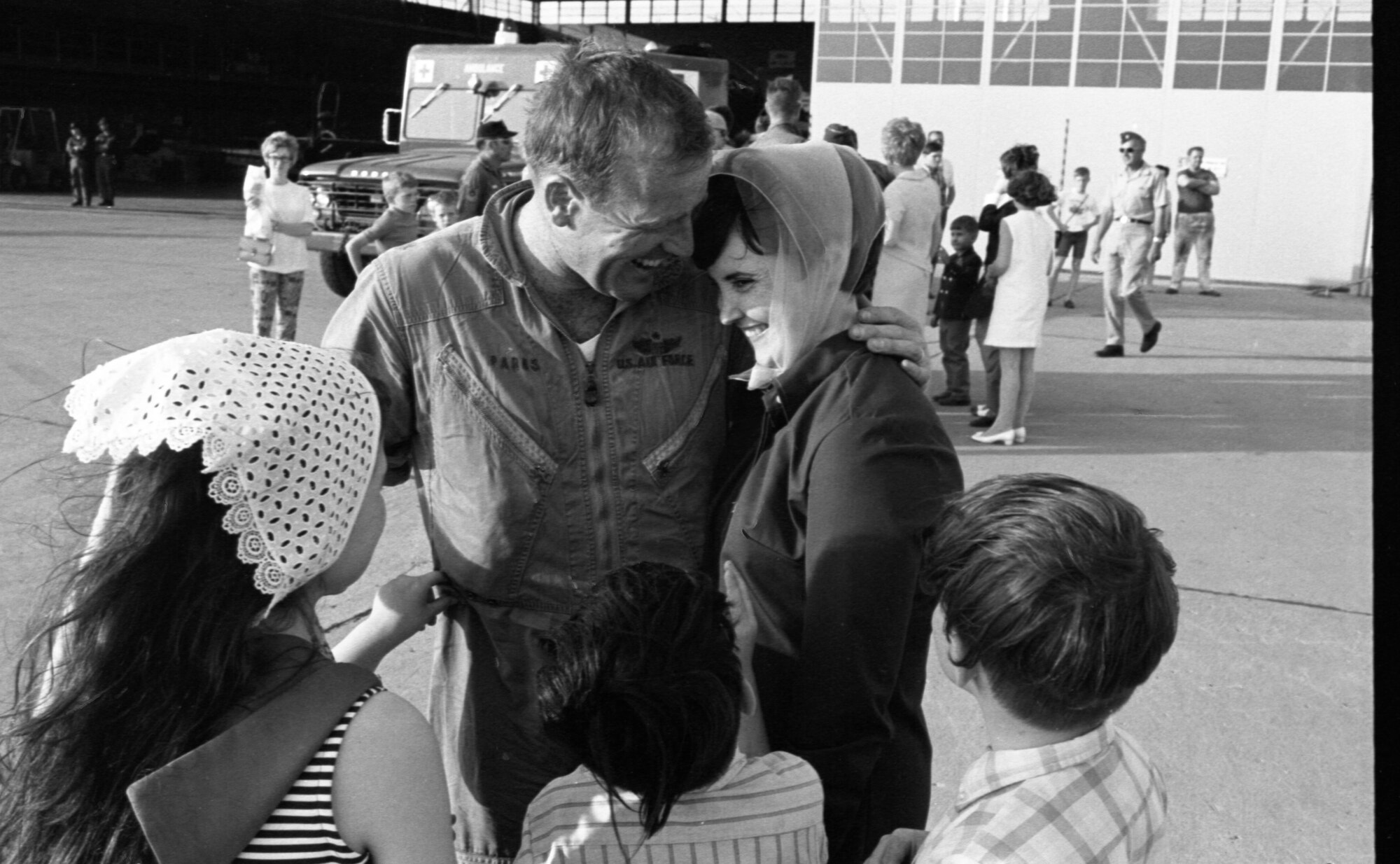 Iowa Air National Guard Captain, Pat Parks an F-100 fighter pilot with the 185th Tactical Fighter Group is greeted by his family in Sioux City, Iowa on May 14, 1969 after returning home from the war in Vietnam. Parks is returning with the rest of the 185th from yearlong duty at Phu Cat Airbase in South Vietnam. (U.S. Air National Guard photo/released 185th TFG Photo)