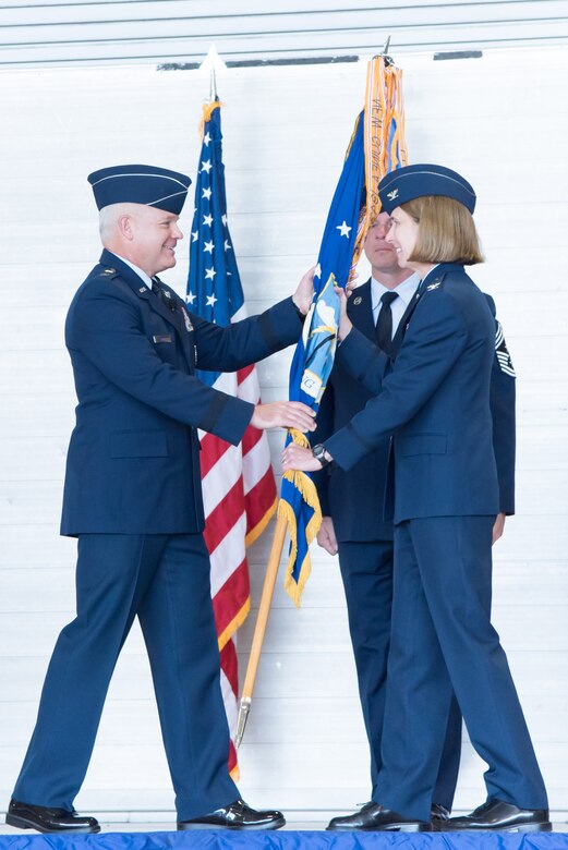 Maj. Gen. John P. Stokes, 22nd Air Force commander, passes the 403rd Wing guidon to Col. Jennie R. Johnson, 403rd Wing commander, during a change of command ceremony May 7, 2017 at Keesler Air Force Base, Mississippi. (U.S. Air Force photo/Staff Sgt. Heather Heiney)