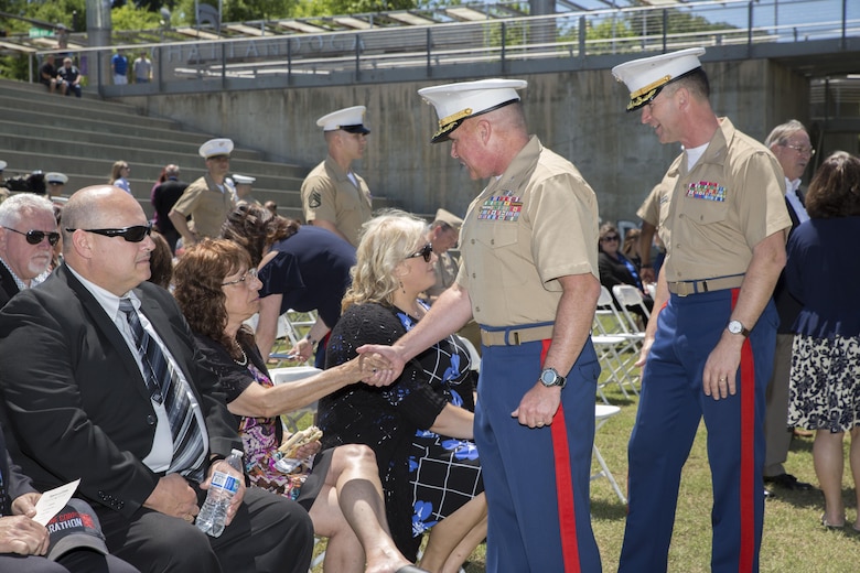 Col. Joseph Russo, command officer of 14th Marine Regiment, 4th Marine Division, along with Col. Jeffrey Smitherman, commanding officer for 6th Marine Recruiting District, greet the family members of Gunnery Sgt. Thomas Sullivan and Staff Sgt. David Wyatt, at Ross’s Landing in Chattanooga, Tenn., May 7, 2017. Sullivan and Wyatt were posthumously awarded the medal for their actions during the July 16, 2015 shooting that occurred at the Naval Reserve Center Chattanooga that left two other Marines and a sailor dead. (U.S. Marine Corps Photo by Lance Cpl. Niles Lee/Released)