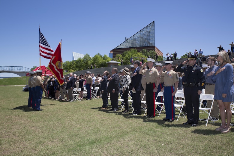 Attendees stand for the posting of the colors during a ceremony posthumously awarding the Navy and Marine Corps Medal to Gunnery Sgt. Thomas Sullivan and Staff Sgt. David Wyatt at Ross’s Landing in Chattanooga, Tenn., May 7, 2017. Attendees of the ceremony included Maj. Gen. Burke W. Whitman, commanding general of 4th Marine Division, Sgt. Maj. Michael A. Miller, sergeant major of 4th MARDIV and family members of GySgt Thomas Sullivan and SSgt David Wyatt. (U.S. Marine Corps Photo by Lance Cpl. Niles Lee/Released)