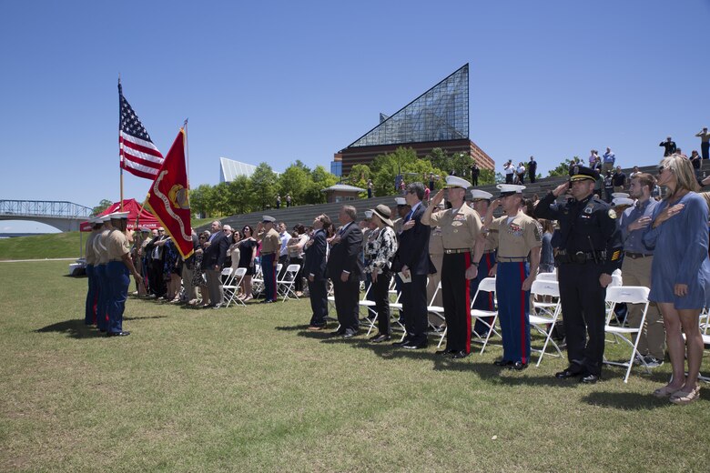 Attendees stand for the posting of the colors during a ceremony posthumously awarding the Navy and Marine Corps Medal to Gunnery Sgt. Thomas Sullivan and Staff Sgt. David Wyatt at Ross’s Landing in Chattanooga, Tenn., May 7, 2017. Attendees of the ceremony included Maj. Gen. Burke W. Whitman, commanding general of 4th Marine Division, Sgt. Maj. Michael A. Miller, sergeant major of 4th MARDIV and family members of GySgt Thomas Sullivan and SSgt David Wyatt. (U.S. Marine Corps Photo by Lance Cpl. Niles Lee/Released)