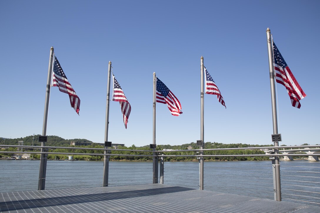 The Fallen Five Memorial overlooks the Tennessee River at Ross’s Landing Park, Chattanooga, Tenn., May 7, 2017. The flags and plaques dedicated to the five service members who were killed in the July 16, 2015 shooting, were replaced May 6, 2017, after almost two years of service. (U.S. Marine Corps Photo by Lance Cpl. Niles Lee/Released)