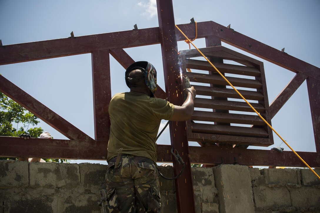 Philippine Army Pfc. Leo Genn Layson welds the framework of a roof on a school classroom at Duran Elementary School in Dumalag, Capiz, April 29, 2017 as part of a humanitarian civic action project for Balikatan 2017. Layson is a welder with the 53rd Engineer Brigade, Philippine Army. Balikatan is an annual U.S.-Philippine bilateral military exercise focused on a variety of missions, including humanitarian assistance and disaster relief, counterterrorism, and other combined military operations. 