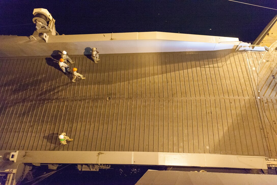 U.S. Soldiers come aboard the USNS Fisher (T-AKR 301) to unload equipment for use in Balikatan in Subic Bay, Zambales, April 30, 2017. Balikatan is an annual U.S.-Philippine bilateral military exercise focused on a variety of missions, including humanitarian assistance and disaster relief, counterterrorism and other combined military operations.