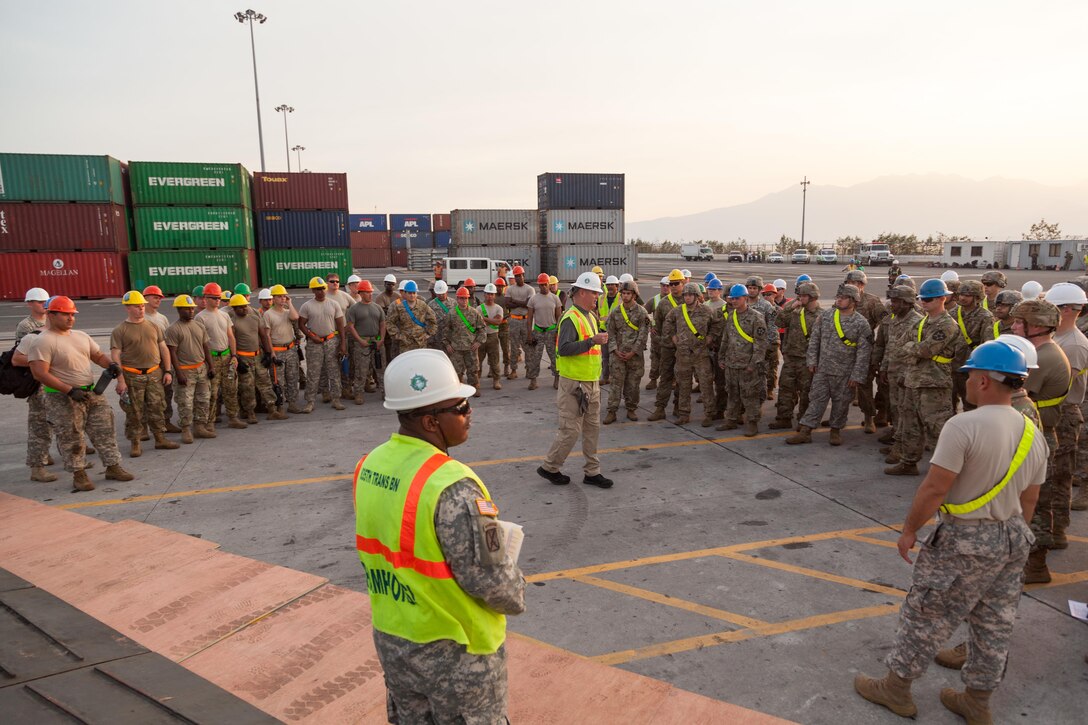 U.S. Soldiers receive a safety brief before unloading equipment from USNS Fisher (T-AKR 301) during Balikatan 2017 in Subic Bay, Zambales, April 30, 2017. Balikatan is an annual U.S.-Philippine bilateral military exercise focused on a variety of missions, including humanitarian assistance and disaster relief, counterterrorism and other combined military operations. 