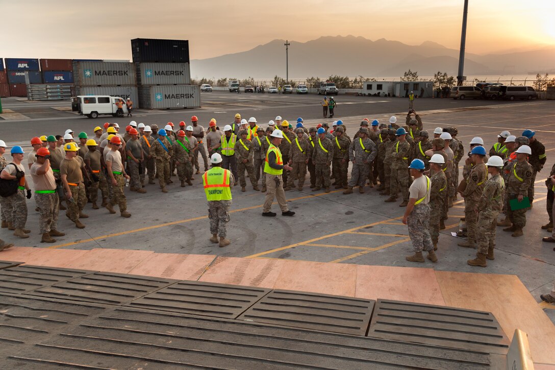 U.S. Army soldiers receive a safety brief before unloading equipment from USNS Fisher (T-AKR 301) during Balikatan 2017 in Subic Bay, Zambales, April 30, 2017. Balikatan is an annual U.S.-Philippine bilateral military exercise focused on a variety of missions, including humanitarian assistance and disaster relief, counterterrorism and other combined military operations.