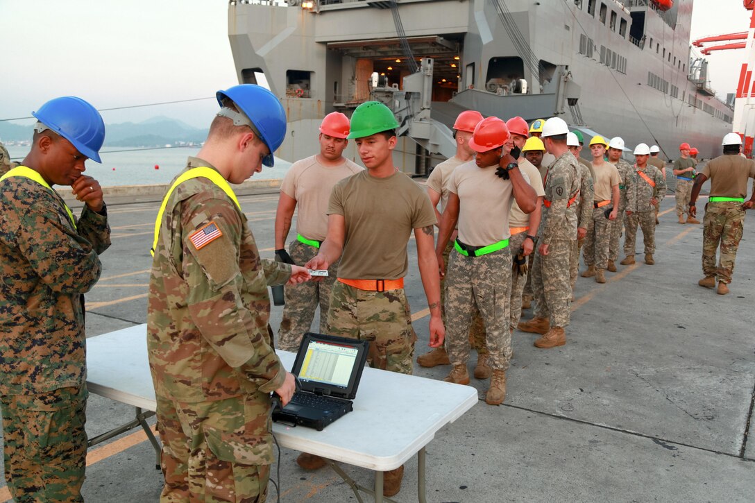 U.S. Soldiers check in before unloading equipment from USNS Fisher (T-AKR 301) during Balikatan 2017 in Subic Bay, Zambales, April 30, 2017. Balikatan is an annual U.S.-Philippine bilateral military exercise focused on a variety of missions, including humanitarian assistance and disaster relief, counterterrorism and other combined military operations. 
