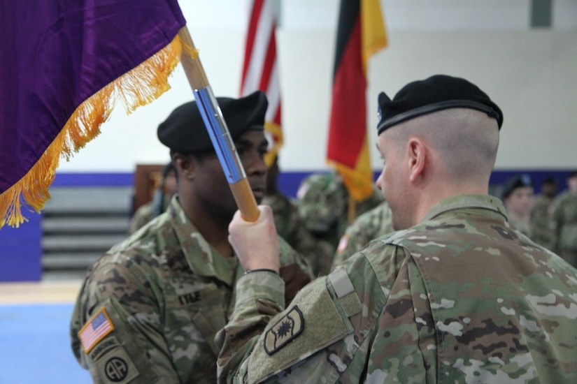 Army Lt. Col. Clifton C. Kyle (left), commander of the 457th Civil Affairs Battalion , receives the unit guidon from Col. John T. Novak, commander of the 361st CA Brigade, 7th Mission Support Command in a change of command ceremony held at the Field House, Tower Barracks, United States Army Garrison, Bavaria on May 7, 2017.  