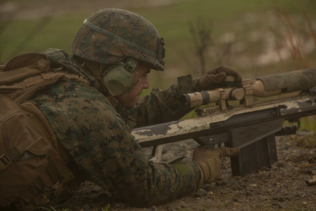 A Marine adjusts the scope of a Barrett M107 Special Applications Scoped Rifle during a live-fire range at Fort A.P. Hill, VA., April 25, 2017. The Marines participated in the training to improve their proficiency and accuracy with their weapon systems and to prepare for an upcoming deployment as a crisis response force. The Marines are with 2nd Battalion, 2nd Marine Regiment. (U.S. Marine Corps photo by Pfc. Abrey D. Liggins)