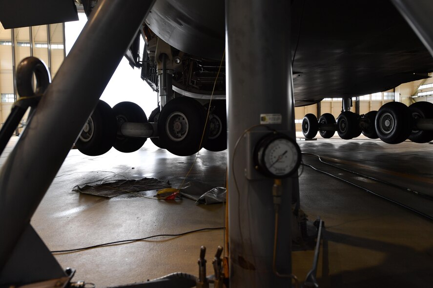 A C-5M Galaxy landing gear spins into position while the aircraft rests on six fuselage jacks on Ramstein Air Base, Germany, May 3, 2017. Flying out of Travis Air Force Base, Calif., to Ramstein, the number four landing gear malfunctioned during landing. After the crew made a safe landing, the aircraft was towed and jacked to inspect all the landing gears and repair the malfunctioned one. Airmen assigned to the 721st Aircraft Maintenance Squadron and 60th AMXS worked together to fix the aircraft. (U.S. Air Force Senior Airman Tryphena Mayhugh)