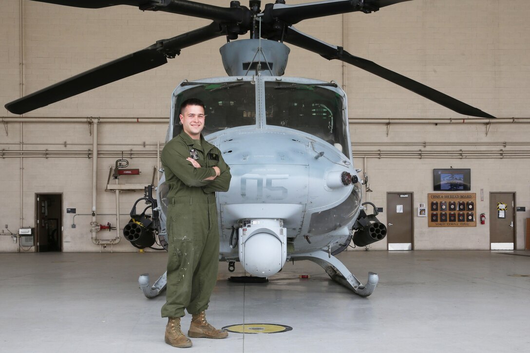 Marine Corps Cpl. Tyler Eddy, an airframes mechanic with Marine Light Attack Helicopter Squadron 169, stands in front of a UH-1Y Huey helicopter at Marine Corps Air Station Camp Pendleton, Calif., April 24, 2017. This July, Eddy is expected to complete his active-duty enlistment with the Marine Corps and pursue a doctorate in physics at Princeton University in Princeton, N.J. Marine Corps photo by Lance Cpl. Jake M.T. McClung