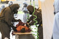 Soldiers from the 51st Chemical Company 83rd Battalion stationed in Fort Stewart, Ga., decontaminate a battle mannequin during a simulated improvised nuclear device explosion April 29, 2017, as part of Guardian Response at Muscatatuck Urban Training Center, Ind. Exercise Guardian Response is a multi-component training exercise run by the U.S. Army Reserve designed to validate more than 4,000 service members in Defense Support of Civil Authorities in the event of a Chemical, Biological, Radiological and Nuclear catastrophe. This year's exercise simulated an improvised nuclear device explosion with a source region electromagnetic pulse out to more than four miles. The 84th Training Command hosted the exercise, and the 78th Training Division, headquartered in Joint Base McGuire-Dix-Lakehurst, New Jersey, conducted the training. (U.S. Army Reserve Photo by Staff Sgt. Brad Ruffin, 206th Broadcast Operations Detachment)