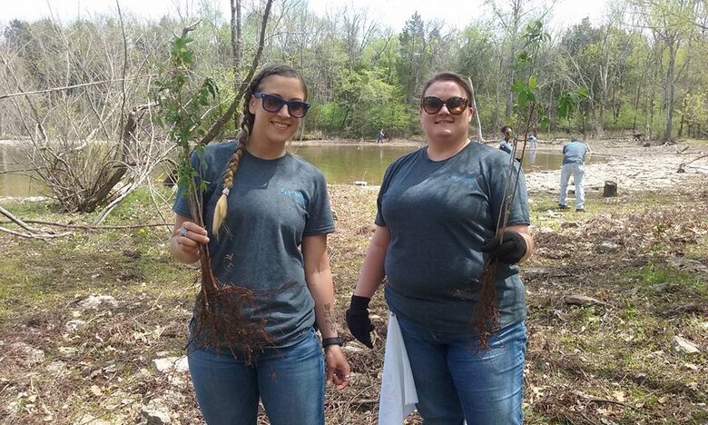 Stephanie Bury and LeAnn Powers both volunteers from VF Imagewear, Inc., plant trees during a lake clean up at the Cook Recreation Area at the J. Percy Priest Lake on April 13, 2017.  