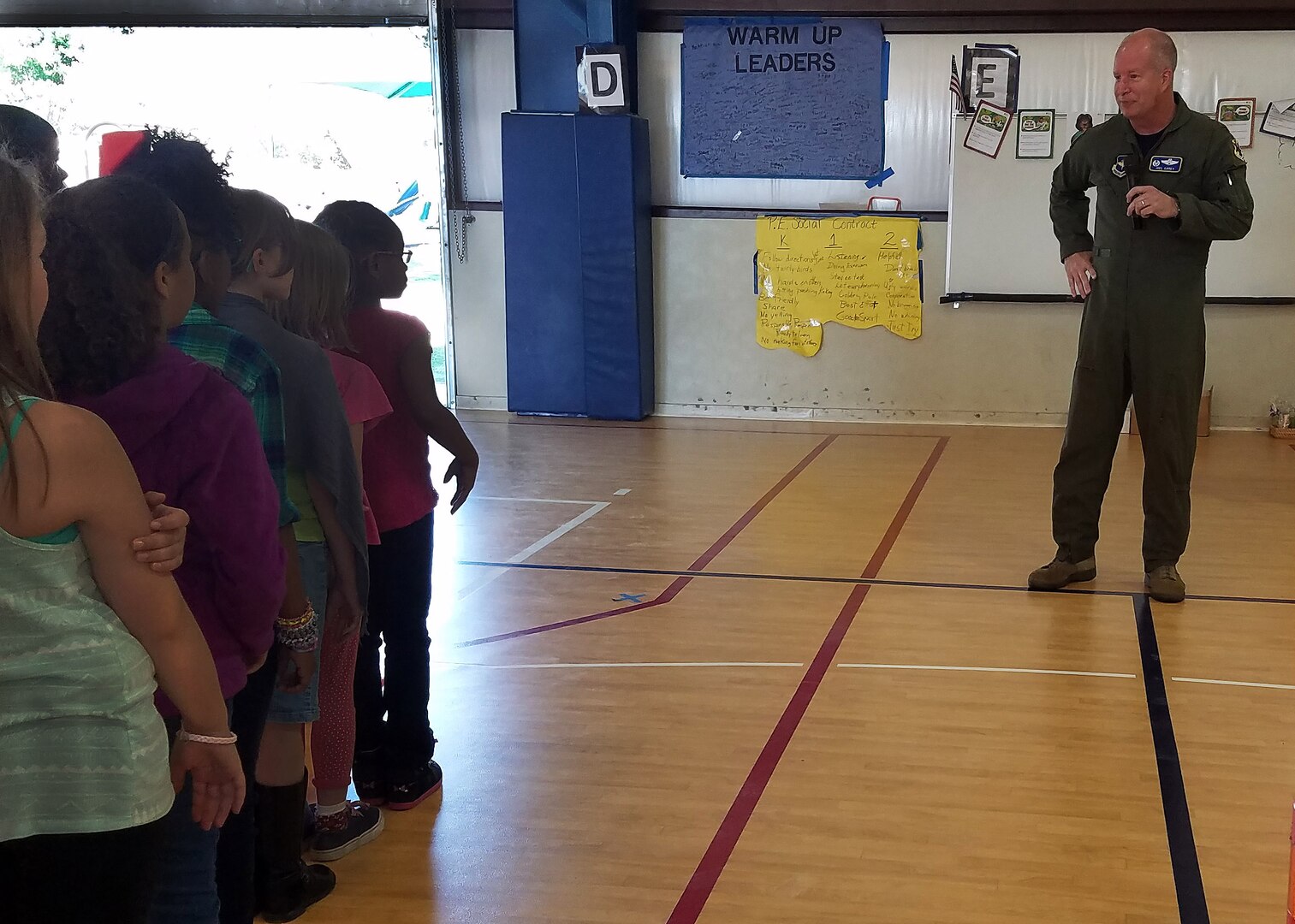 Col. Joel Carey, 12th Flying Training Wing commander speaks to third-, fourth- and fifth-grade students as they prepare to begin the deployment process as part of Operation FLAGS May 5, 2017 on the Randolph Elementary School campus at JBSA-Randolph, Texas. Operation FLAGS, which stands for Families Learning About Global Support, is a means of educating families about what their loved ones go through when they deploy.