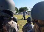 Senior Airmen Victoria Dunning, 902nd Security Forces Squadron military working dog handler, introduce third-, fourth- and fifth-grade students to the deployment process as part of Operation FLAGS May 5, 2017 on the Randolph Elementary School campus at JBSA-Randolph, Texas. Operation FLAGS, which stands for Families Learning About Global Support, is a means of educating families about what their loved ones go through when they deploy.