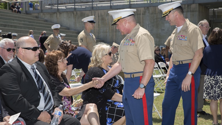 Col. Joseph Russo, command officer of 14th Marine Regiment, 4th Marine Division, along with Col. Jeffrey Smitherman, commanding officer for 6th Marine Recruiting District, greet the family members of Gunnery Sgt. Thomas Sullivan and Staff Sgt. David Wyatt, at Ross’s Landing in Chattanooga, Tenn., May 7, 2017. Sullivan and Wyatt were posthumously awarded the medal for their actions during the July 16, 2015 shooting that occurred at the Naval Reserve Center Chattanooga that left two other Marines and a sailor dead. 