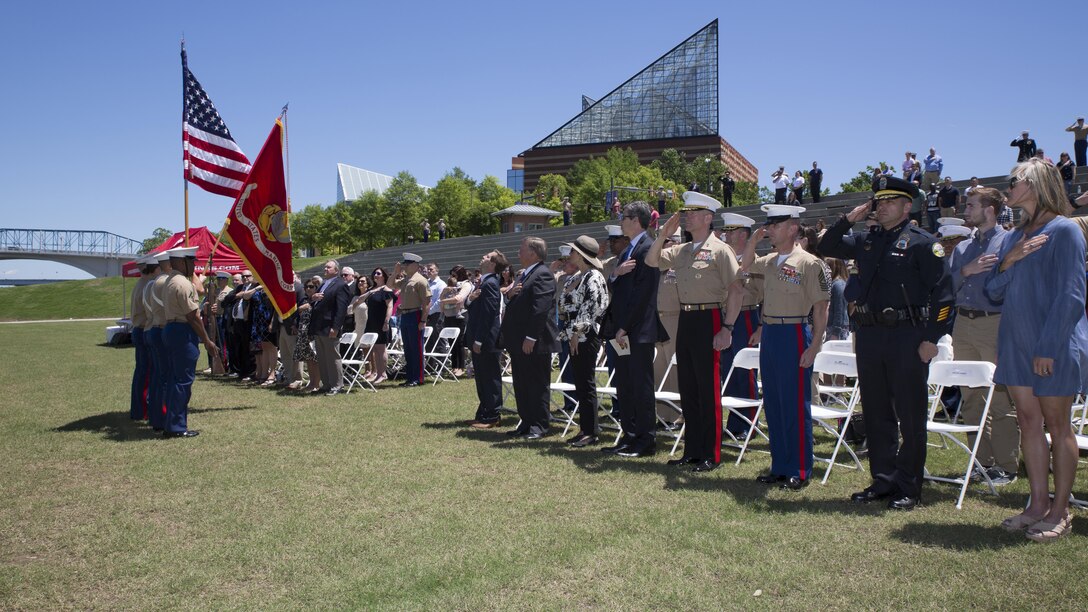 Attendees stand for the posting of the colors during a ceremony posthumously awarding the Navy and Marine Corps Medal to Gunnery Sgt. Thomas Sullivan and Staff Sgt. David Wyatt at Ross’s Landing in Chattanooga, Tenn., May 7, 2017. Attendees of the ceremony included Maj. Gen. Burke W. Whitman, commanding general of 4th Marine Division, Sgt. Maj. Michael A. Miller, sergeant major of 4th MARDIV and family members of GySgt Thomas Sullivan and SSgt David Wyatt. 