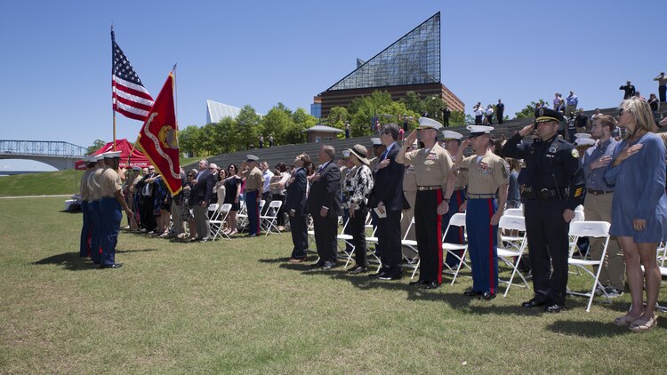Attendees stand for the posting of the colors during a ceremony posthumously awarding the Navy and Marine Corps Medal to Gunnery Sgt. Thomas Sullivan and Staff Sgt. David Wyatt at Ross’s Landing in Chattanooga, Tenn., May 7, 2017. Attendees of the ceremony included Maj. Gen. Burke W. Whitman, commanding general of 4th Marine Division, Sgt. Maj. Michael A. Miller, sergeant major of 4th MARDIV and family members of GySgt Thomas Sullivan and SSgt David Wyatt. 