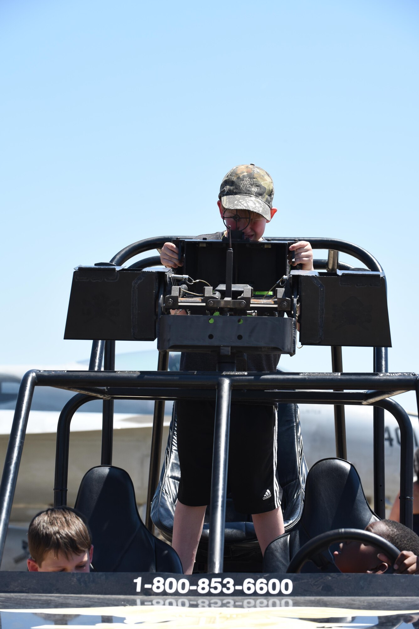 A child aims through the sites on an all-terrain vehicle during the 2017 Defenders of Liberty Air Show at Barksdale Air Force Base, La., May 7. Thousands of visitors toured static displays during the air show, getting up close with more than 60 aircraft and vehicles on the flightline. (U.S. Air Force photo/Senior Airman Luke Hill)