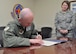 Col. Ron Allen, 341st Missile Wing commander, signs a proclamation celebrating the accomplishments and efforts of medical technicians and nursing services personnel throughout the year and during National Nurse/Technician Week. The appreciation week runs May 6-12 and is devoted to highlighting the diverse ways in which nursing personnel, the largest healthcare profession, are working to improve healthcare.  (U.S. Air Force photo/John Turner)