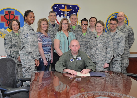 Col. Ron Allen, 341st Missile Wing commander, center, poses with Airmen from the 341st Medical Group after signing a proclamation celebrating the accomplishments and efforts of medical technicians and nursing services personnel throughout the year and during National Nurse/Technician Week. The appreciation week runs May 6-12 and is devoted to highlighting the diverse ways in which nursing personnel, the largest healthcare profession, are working to improve healthcare.  (U.S. Air Force photo/John Turner)