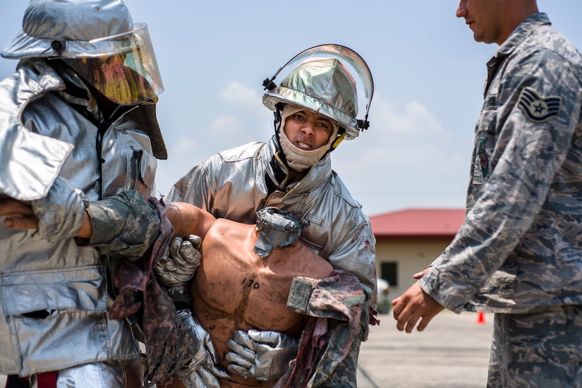 A firefighter from Central America participate in a timed event after learning new techniques during Central America Sharing Mutual Operational and Experience at Joint Task Force – Bravo, Apr. 25, 2017. CENTAM SMOKE is a biannual exercise hosted by Joint Task Force – Bravo with 35 participants from across the 7 Central America nations that includes safety, personal protective equipment, apparatus familiarization, fire hose applications, structural/helicopter live fire evolutions, medical training, vehicle extrication, and aircraft (UH–60/CH–47) egress familiarization, Apr. 24-28, 2017. (U.S. Air National Guard photo by Master Sgt. Scott Thompson/released)