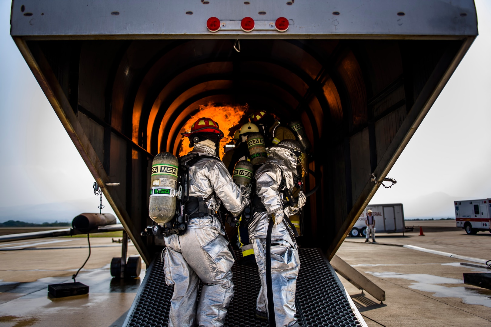 Firefighters from Central America learn new fire hose techniques at a live fire exercise during Central America Sharing Mutual Operational and Experience at Joint Task Force – Bravo, Apr. 26, 2017. CENTAM SMOKE is a biannual exercise hosted by Joint Task Force – Bravo with 35 participants from across the 7 Central America nations that includes safety, personal protective equipment, apparatus familiarization, fire hose applications, structural/helicopter live fire evolutions, medical training, vehicle extrication, and aircraft (UH–60/CH–47) egress familiarization, Apr. 24-28, 2017. (U.S. Air National Guard photo by Master Sgt. Scott Thompson/released)