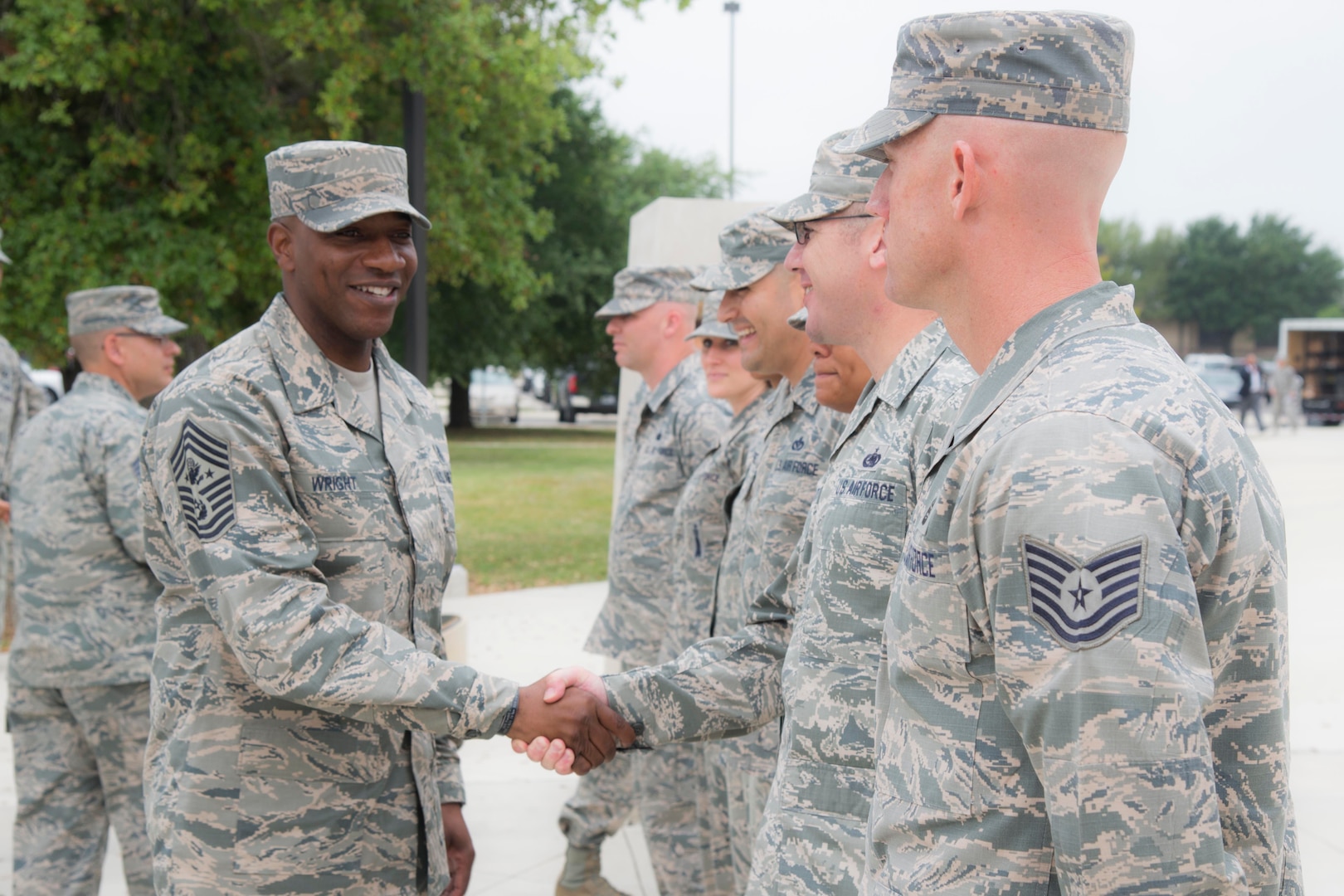 Chief Master Sgt. of the Air Force Kaleth O. Wright greets Airmen’s Week facilitators
from the 326th Training Squadron May 3, 2017, outside the Pfingston Reception
Center at Joint Base San Antonio-Lackland, Texas. Airmen’s Week facilitators are Air
Force military training instructors who lead discussion-based classes focused on
internalization of Air Force core values and developing professional, resilient
Airmen inspired by heritage and motivated to deliver Air Power for America. (U.S.
Air Force photo by Airman Dillon Parker)