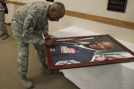 Chief Master Sgt. of the Air Force Kaleth O. Wright signs his official portrait May 3,
2017, inside the Chiefs’ Room at the Pfingston Reception Center at Joint Base San
Antonio-Lackland. Each living Airman who has served as chief master sergeant of
the Air Force has visited JBSA-Lackland to autograph their portraits, which are
displayed in a room dedicated to the Air Force’s highest enlisted leaders.