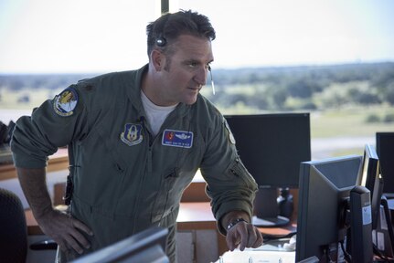 Maj. Andrew Van De Walle, 39th Flying Training Squadron instructor pilot supervises flight control tower operations May 4, 2017, at Joint Base San Antonio-Randolph during the Cobras in the Clouds exercise. The exercise gave 39th FTS members a chance to practice their war-time mission of taking control of the training mission of the 12th Operations Group. (U.S. Air Force photo by Senior Airman Stormy Archer)