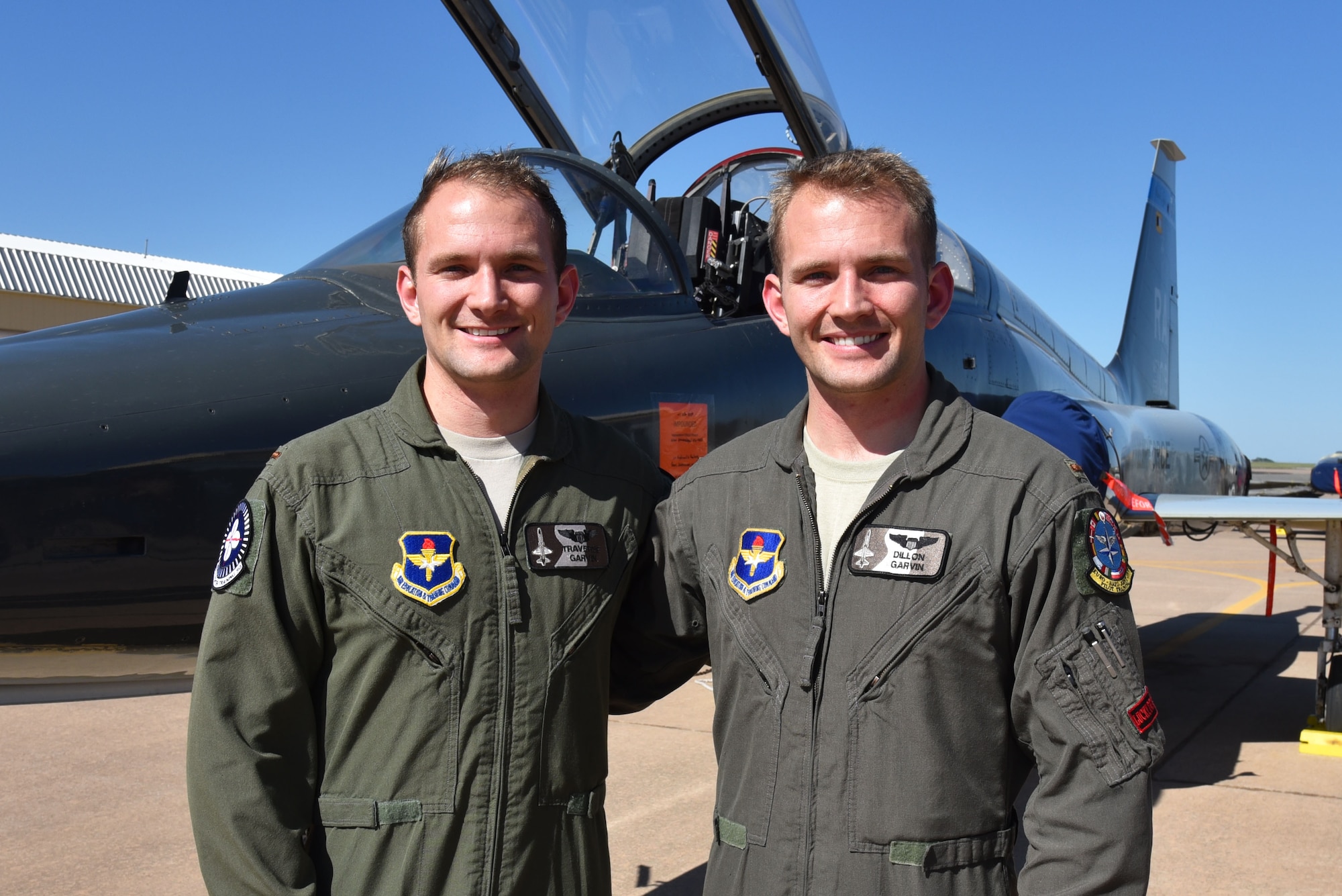 Identical twins 2nd Lt. Traverse Garvin and 2nd Lt. Dillon Garvin approach the end of their time at Sheppard Air Force Base, Texas, March 3, 2017. The brothers will continue their careers by learning to fly the F-22 Raptor at Tyndall Air Force Base, Florida. (U.S. Air Force photo by 2nd Lt. Jacqueline Jastrzebski)