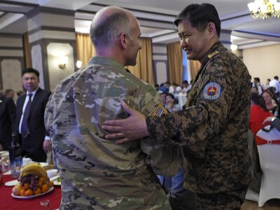 Mongolia National Emergency Management Agency Brig. Gen. Badral Tuvshin, right, greets U.S. Army Maj. Edwin Morton, Gobi Wolf 2017 exercise director and lead U.S. planner, May 1, 2017, during an exercise reception dinner in Dalanzadgad, Mongolia. GW 17 is hosted by the Mongolia National Emergency Management Agency and Mongolian Armed Forces as part of the United States Army Pacific’s humanitarian assistance and disaster relief “Pacific Resilience” series. 